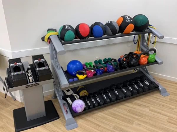 Weights and accessories at the Long Term Care facility Fitness Room.